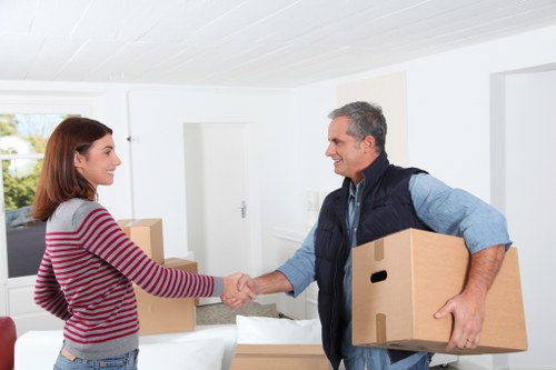 Local moving team handling boxes near Belgravia properties