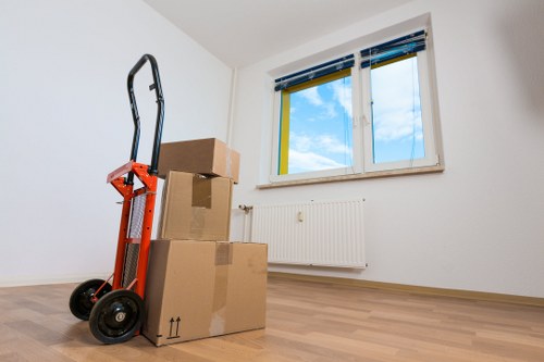 Organised office relocation setup with labelled boxes and workspace furniture